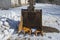 Rusted bucket on snow background