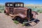 Rusted carcass of old abandoned car at Historic Route 66 in Arizona USA