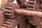 The rusted cogs and gears of a historic boat winch used on the F