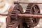 The rusted cogs and gears of a historic boat winch used on the F