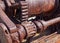 Rusted cogs and gears on an old broken industrial machine