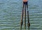 A rusted and disused jetty bollard