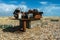 Rusted engine on pebbles beach