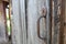 Rusted handle on wooden door