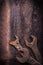 Rusted hook wrenches on vintage leather