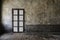 Rusted iron bars door on old wall