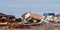 Rusted metal and old refrigerator along with other trash