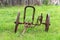 Rusted old metal plow. Antique farm