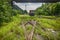 Rusted railway and abandoned carriage