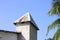 Rusted roof of a maldivian building with palm leaves