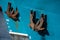 Rusted rugged Anchor on blue fishing ship