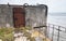 Rusted steel door, entrance to abandoned bunker