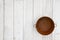 Rusted tin pail on weathered whitewash textured wood background