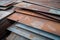 rusted and weathered aluminum sheets on a factory floor