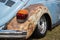 A rusted wheel arch on a vintage car