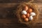 Rustic allure Chicken eggs nestled in a wooden nest background