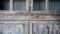 Rustic Americana: Close-Up of Worn Wooden Cabinet with Glass Panels