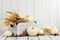 Rustic autumn decor against white wood