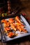 Rustic backed chicken wings,legs on baking tray