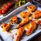 Rustic backed chicken wings,legs on baking tray