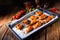 Rustic backed chicken wings,legs on baking tray