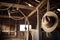 rustic barn with cowboy hat and rope hanging from the ceiling