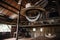 rustic barn with cowboy hat and rope hanging from the ceiling