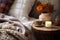 A rustic bedside table, a candle and a cozy blanket. Boho home decor. Ethnic bedroom interior. Generative AI