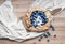 Rustic blueberry pie on a wooden board and white tissue