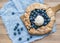 Rustic blueberry pie on a wooden board and white tissue