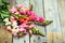 Rustic bouquet of snapdragon (Antirrhinum majus) on vintage wood