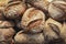 Rustic bread pile. Crusty bread background. Bakery products