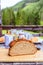 Rustic breakfast on an alpine hut: fresh crisp bread and milk in glass bottle, outdoors