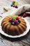 Rustic bundt cake with berries and mint