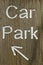 Rustic car park directional sign with arrow