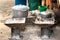 Rustic charcoal stoves and cookware, pots and pans on the floor at the local market of Toliara, Madagascar