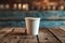 Rustic charm Paper cup of coffee against a wooden wall