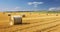 The Rustic Charm of Straw Bales Lying in a Field After Harvest