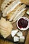 Rustic cheese board platter with bread and redcurrant jam