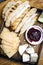 Rustic cheese board platter with bread and redcurrant jam