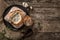 Rustic chicken soup with mushrooms in bread with spices on rustic wooden background. Healthy food concept, top view, flat lay,