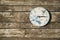 Rustic clock on wooden wall
