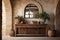 Rustic console table and wooden arched door in hallway with stone tiled floor