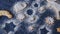 Rustic Cookies of Various Shapes and Forms Dusted with Powdered Sugar on a Blue Paper Background