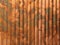 Rustic corrugated metal copper industrial background with brown grungy colors