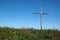 Rustic Cross over blue sky