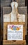 Rustic Cuttingboard with rough wooden plaque in front that says Expect Nothing be grateful for everything - Thanksgiving motif