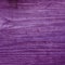 Rustic distressed wood background texture with a unique purple color