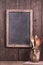 Rustic empty menu blackboard on wooden wall