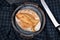 Rustic european spelt flour loaf of bread on iron tray